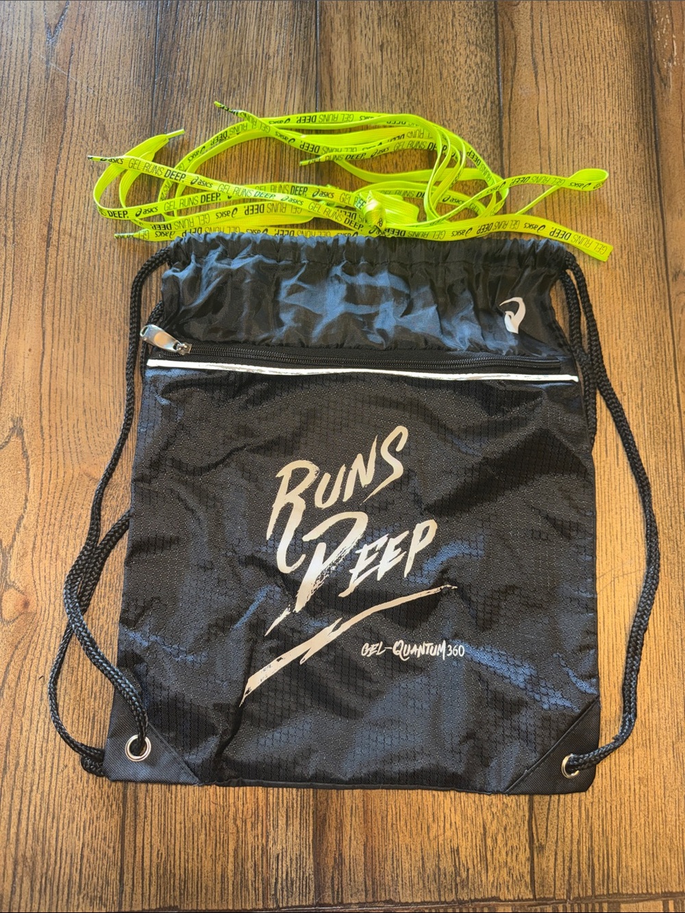 Asics Black Drawstring Backpack with Two Pairs of Neon Yellow Laces